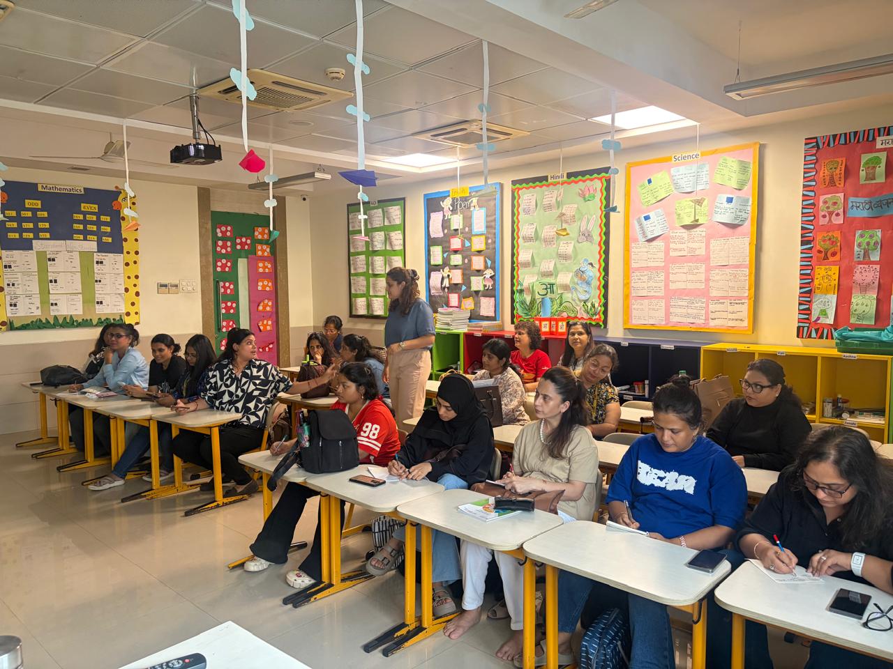 Primary educators participating in a learning activity at MBIS